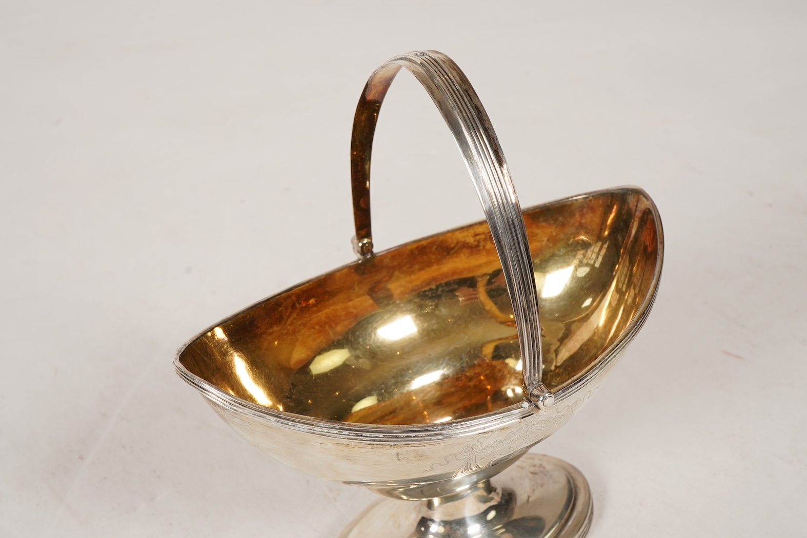 A George III silver boat shaped pedestal sugar basket, by Peter & Ann Bateman
